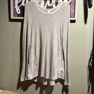 Beautiful tunicwith lace and semi sheer back.